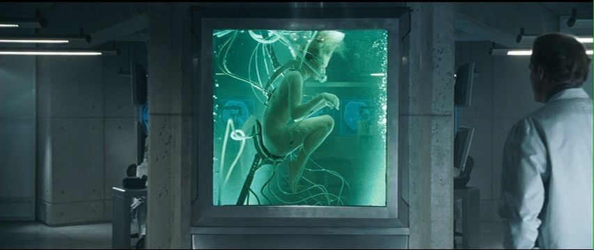Alice, nude in medical tank