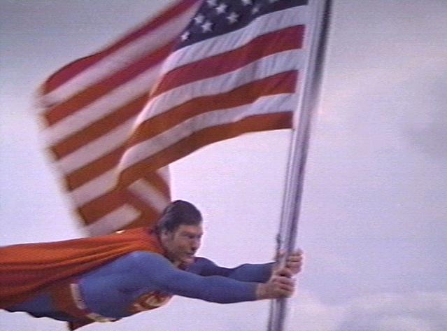 superman flying with US flag